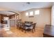 Cozy dining room featuring wood floors and a large dining table for Gathering gatherings at 6274 Elderberry Wine Ave, Las Vegas, NV 89142