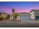 Charming single-story home featuring desert landscaping and an attached two car garage at 6274 Elderberry Wine Ave, Las Vegas, NV 89142