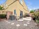 Low-maintenance backyard with desert landscaping and a small patio seating area at 6324 Desert Leaf St # 3, North Las Vegas, NV 89081