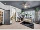 This bedroom is staged as an office and has a lovely grey couch and view of the bathroom at 6324 Desert Leaf St # 3, North Las Vegas, NV 89081