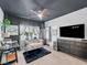 This lovely staged office includes a loveseat and a large black dresser and tv set at 6324 Desert Leaf St # 3, North Las Vegas, NV 89081
