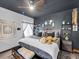 Stylish bedroom features dark ceiling and modern decor at 6324 Desert Leaf St # 3, North Las Vegas, NV 89081