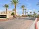 Gated Black Hawk community entrance with palm trees and well-maintained landscaping at 6324 Desert Leaf St # 3, North Las Vegas, NV 89081