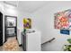 Upstairs hallway with art and a view to the bathroom at 6324 Desert Leaf St # 3, North Las Vegas, NV 89081