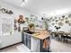 This kitchen features a modern sink, a breakfast bar, and view to the dining room at 6324 Desert Leaf St # 3, North Las Vegas, NV 89081