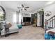 Open-concept living room with neutral colors, modern decor, and hardwood floors at 6324 Desert Leaf St # 3, North Las Vegas, NV 89081