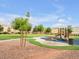 Community playground with modern equipment, set in a well-maintained green space at 6324 Desert Leaf St # 3, North Las Vegas, NV 89081