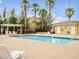 Community pool with lounge chairs and restroom facilities, ideal for summer relaxation at 6324 Desert Leaf St # 3, North Las Vegas, NV 89081