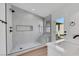 Luxurious walk-in shower with gray tiling and a convenient built-in bench at 6664 Rutgers Dr, Las Vegas, NV 89156