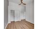 Bedroom features light wood floors, a fan, and closet with sliding doors at 6664 Rutgers Dr, Las Vegas, NV 89156