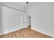 This bedroom features light wood floors, white walls, and a closet at 6664 Rutgers Dr, Las Vegas, NV 89156