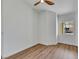Bright bedroom with wood look floors, a ceiling fan, and a window providing plenty of light at 6664 Rutgers Dr, Las Vegas, NV 89156