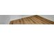 Close-up of pristine wood-look flooring with clean, white baseboards in a room at 6664 Rutgers Dr, Las Vegas, NV 89156