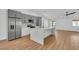 Modern kitchen with stainless steel appliances, quartz countertops, and a large island, perfect for culinary enthusiasts at 6664 Rutgers Dr, Las Vegas, NV 89156