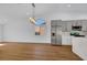 Open floor plan featuring a kitchen with stainless steel appliances and a breakfast bar at 6664 Rutgers Dr, Las Vegas, NV 89156