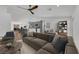 Bright open-concept living room and kitchen featuring modern finishes, stainless steel appliances, and a spacious island at 6664 Rutgers Dr, Las Vegas, NV 89156