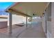 Covered patio overlooking the sparkling pool and landscaped backyard at 6664 Rutgers Dr, Las Vegas, NV 89156