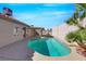 Relaxing pool area surrounded by lush landscaping and a charming patio at 6664 Rutgers Dr, Las Vegas, NV 89156