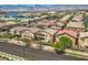 View of homes with solar panels, the backyard, and mountain landscape at 6750 Quapaw St, Las Vegas, NV 89149