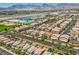 View of homes with solar panels and backyard views surrounded by mountains at 6750 Quapaw St, Las Vegas, NV 89149