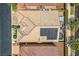 Aerial view featuring a backyard with a solar panel-covered patio and shade structure at 6750 Quapaw St, Las Vegas, NV 89149