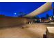 Backyard patio area with a custom-made fire pit and a trampoline at 6750 Quapaw St, Las Vegas, NV 89149