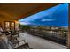 Relaxing outdoor balcony with comfortable seating and a view of the neighborhood at 6750 Quapaw St, Las Vegas, NV 89149