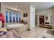 Bathroom featuring a soaking tub, tile floors, and walk-in closet at 6750 Quapaw St, Las Vegas, NV 89149