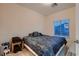 Bedroom featuring a dark comforter, carpet and window at 6750 Quapaw St, Las Vegas, NV 89149