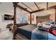 Bedroom featuring a canopy bed with decorative wood trim and matching furniture at 6750 Quapaw St, Las Vegas, NV 89149