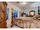 Bedroom featuring a canopy bed with decorative wood trim and matching furniture at 6750 Quapaw St, Las Vegas, NV 89149
