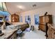 Bedroom featuring a canopy bed with decorative wood trim and matching furniture at 6750 Quapaw St, Las Vegas, NV 89149