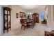 Formal dining room with elegant chandelier, large table set for ten, and classic wood furniture at 6750 Quapaw St, Las Vegas, NV 89149