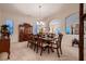Formal dining room featuring chandelier and large table with seating for ten people at 6750 Quapaw St, Las Vegas, NV 89149