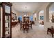 Elegant dining room featuring chandelier, table set for eight and traditional decor at 6750 Quapaw St, Las Vegas, NV 89149