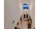 Bright foyer features tile floors and a modern chandelier for a grand welcome at 6750 Quapaw St, Las Vegas, NV 89149