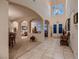 Open and airy foyer with tile flooring, archways, and abundant natural light at 6750 Quapaw St, Las Vegas, NV 89149