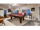 Entertaining game room featuring a pool table, bar, and ample seating at 6750 Quapaw St, Las Vegas, NV 89149