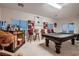 Entertaining game room featuring a pool table, bar area, and comfortable seating at 6750 Quapaw St, Las Vegas, NV 89149