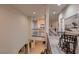 Second floor hallway featuring wood floors, iron railings, and lots of natural light at 6750 Quapaw St, Las Vegas, NV 89149