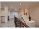 Second floor hallway featuring wood floors, iron railings, and lots of natural light at 6750 Quapaw St, Las Vegas, NV 89149