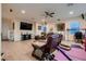 Bright living room with laminate flooring, comfortable seating, and modern amenities at 6750 Quapaw St, Las Vegas, NV 89149