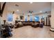 Large living room featuring laminate flooring, comfortable seating and a ceiling fan at 6750 Quapaw St, Las Vegas, NV 89149