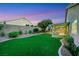 Beautiful backyard with covered patio, perfect for relaxation and outdoor enjoyment at 679 Riverband Pl, Henderson, NV 89052