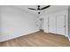 Bright bedroom with sleek floors, modern ceiling fan, and double closets offer ample storage at 679 Riverband Pl, Henderson, NV 89052