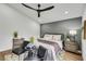 Serene bedroom with a sitting area, comfortable furniture, and modern decor at 679 Riverband Pl, Henderson, NV 89052