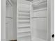 Organized walk-in closet with built-in shelving and ample storage space for clothes and accessories at 679 Riverband Pl, Henderson, NV 89052