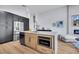 Modern kitchen featuring large island, with stainless steel appliances at 679 Riverband Pl, Henderson, NV 89052