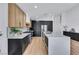 Bright modern kitchen featuring ample storage, and stainless steel appliances at 679 Riverband Pl, Henderson, NV 89052