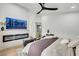 Bedroom showcasing a fireplace, modern decor, and a spacious layout at 679 Riverband Pl, Henderson, NV 89052